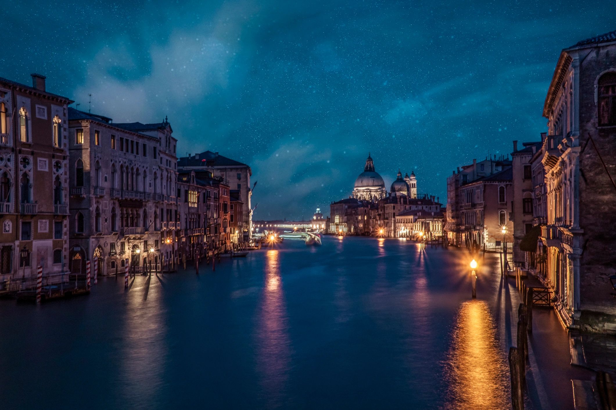 Night cityscape under a starry sky representing astrology in everyday life