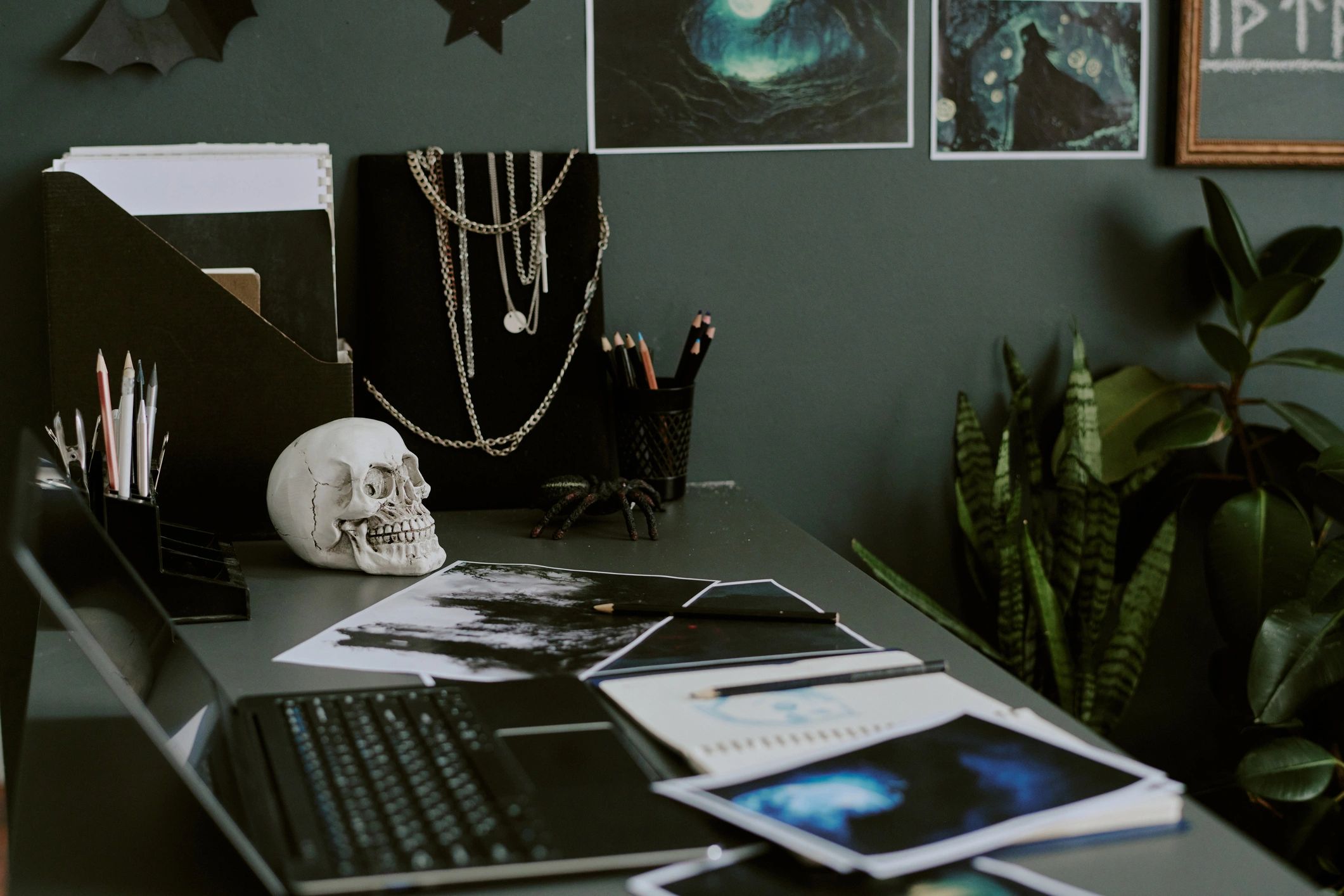 Editorial desk with sketches and laptop for a creative publishing workspace